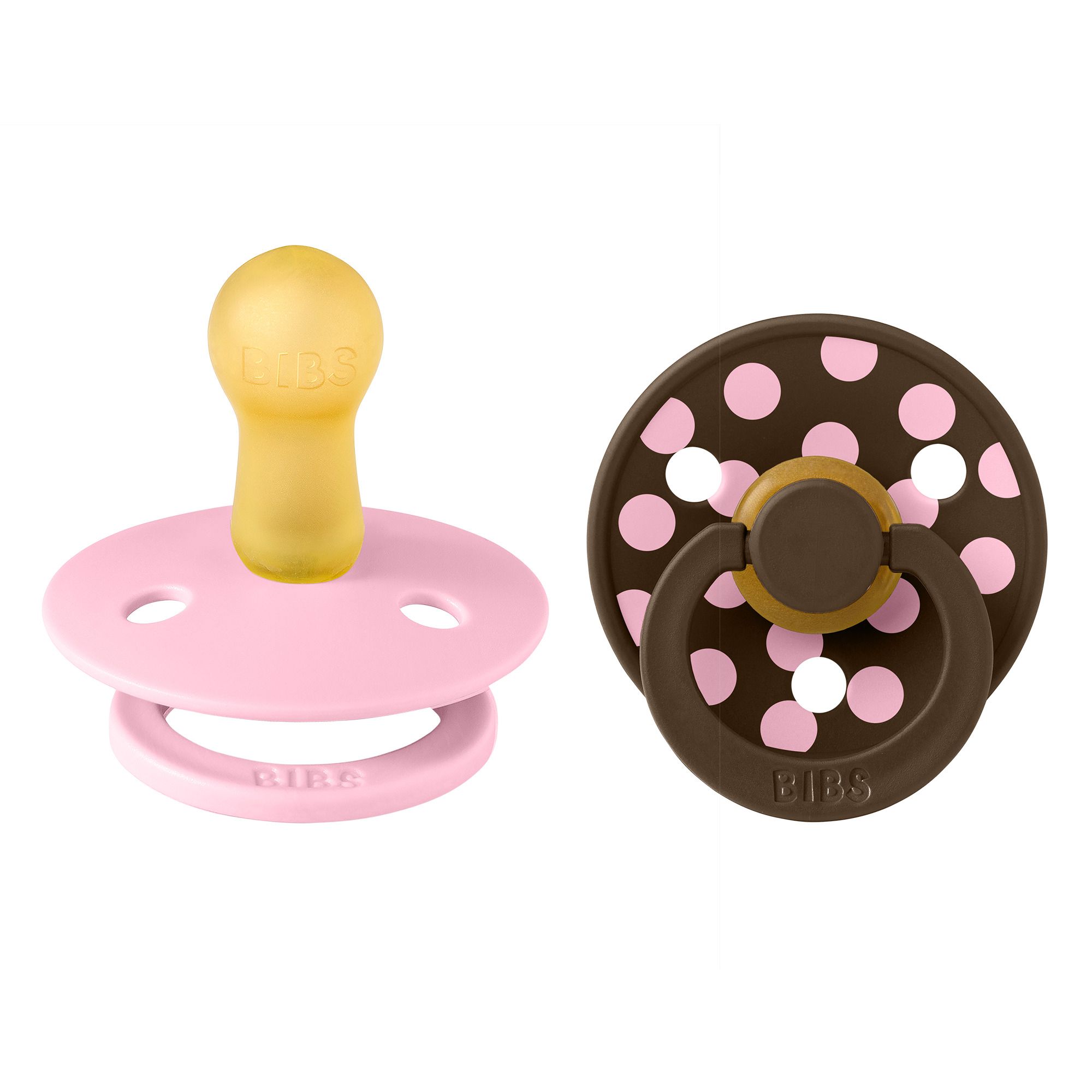 Deux sucettes. Rose et marron à pois blancs. Marque : BIBS. Tétine jaune.