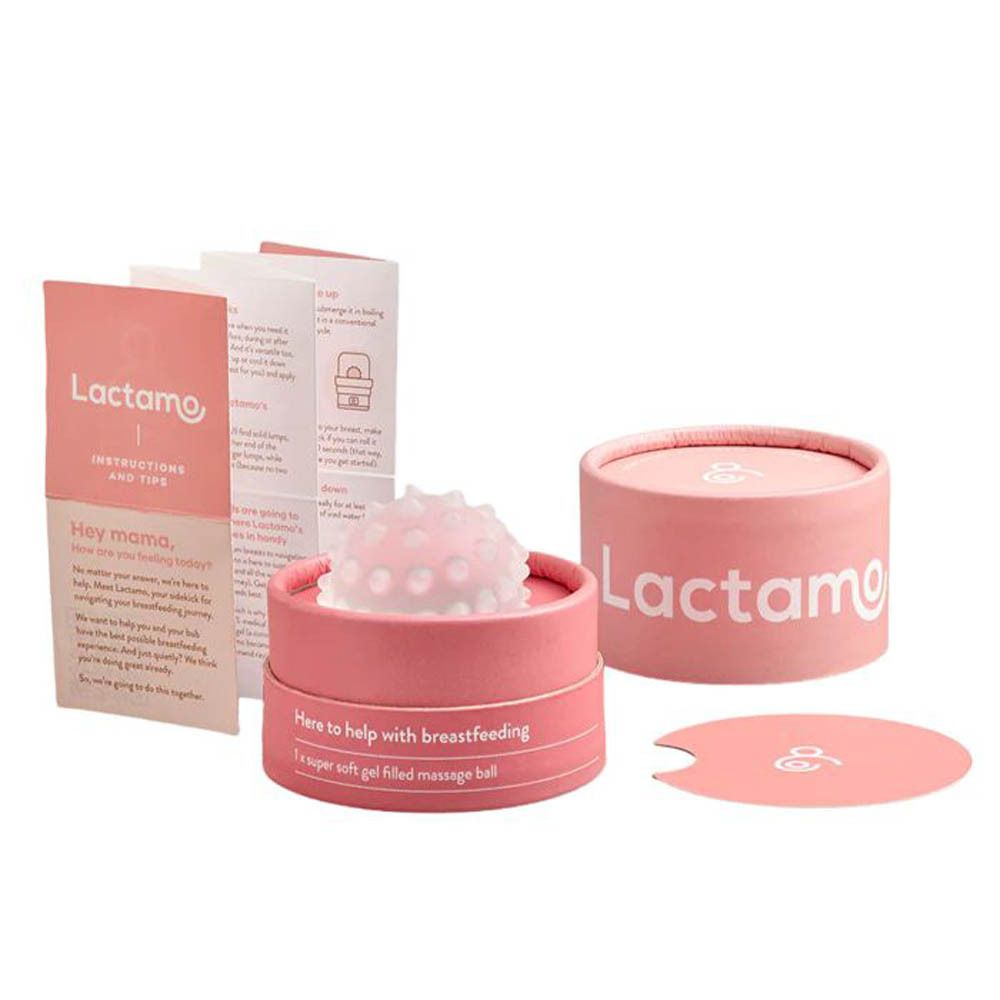 Masseur de sein Lactamo dans son emballage. "A valuable aid for breastfeeding" et le sceau du "International Breastfeeding Journal" sont visibles.