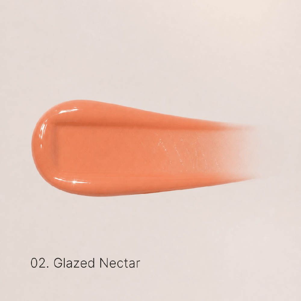 Flacon applicateur du Couleurs de Noir Peptide Lip Glaze 02 Glazed Nectar, ouvert, avec applicateur et capuchon retiré.