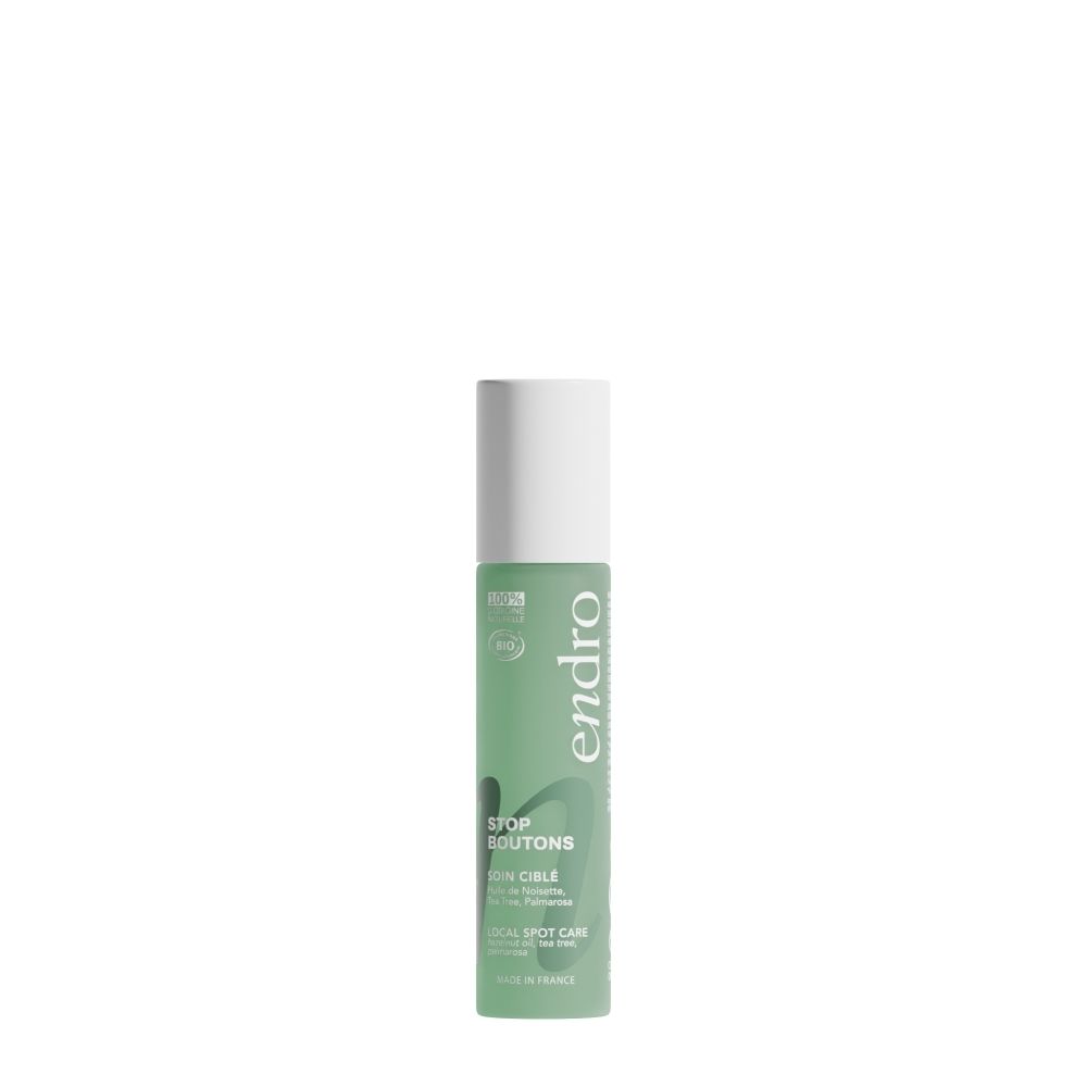 Endro Stop Boutons : Flacon vert à bouchon blanc. Soin ciblé pour imperfections.