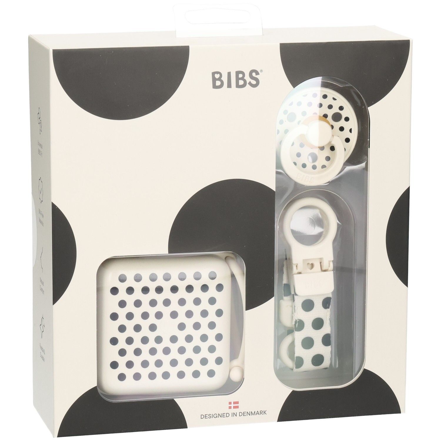 Coffret cadeau avec sucette, boîte et attache-sucette. Emballage à pois noirs. Marque BIBS.
