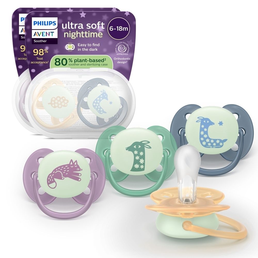 Plusieurs sucettes Philips AVENT, Night Time, de différentes couleurs et motifs. Emballage en arrière-plan.