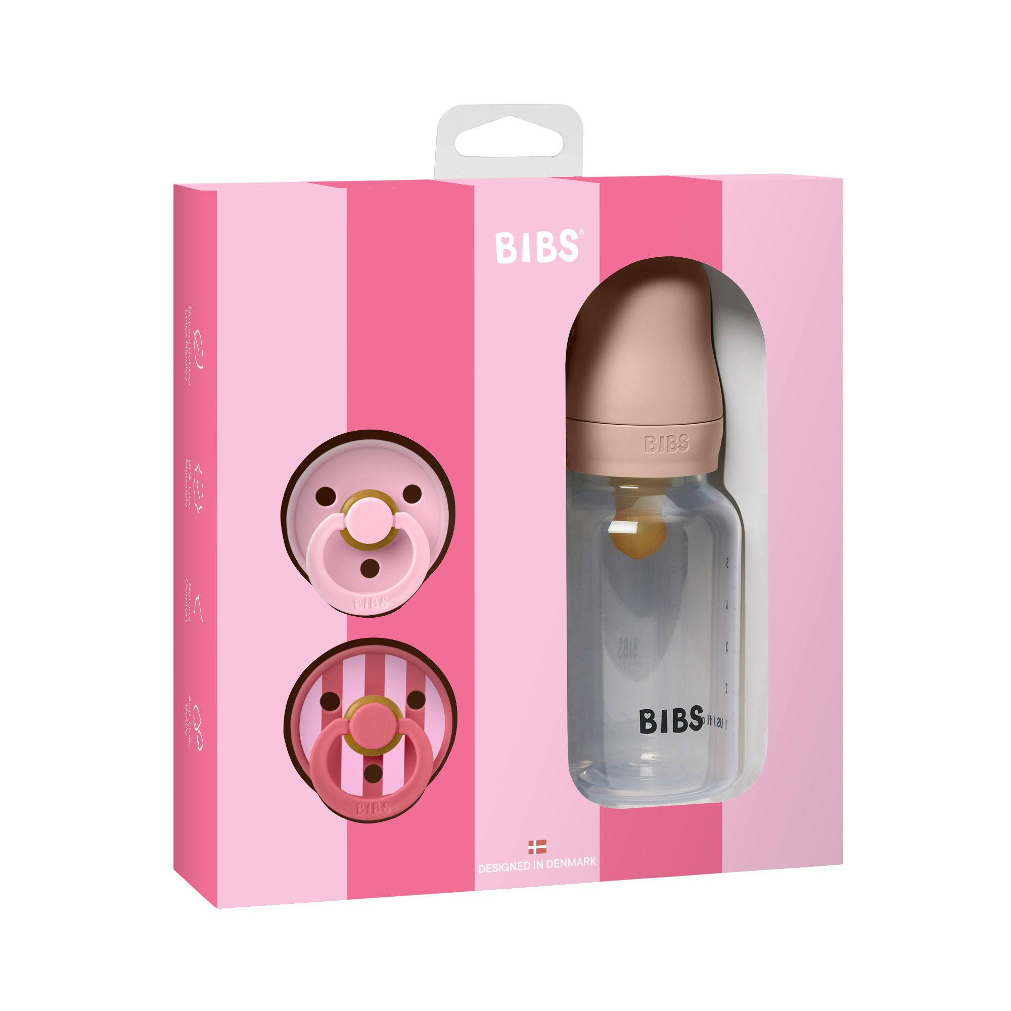 Coffret rose avec sucettes et biberon. Logo BIBS. Biberon transparent avec graduation. Deux sucettes.