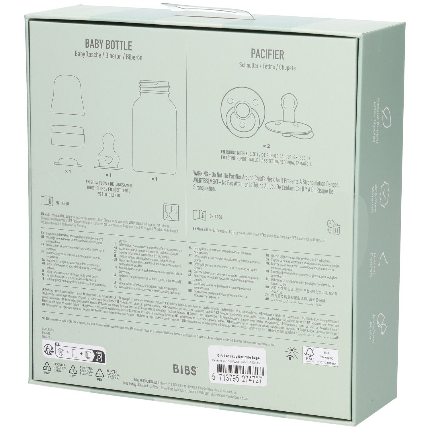Dos du coffret cadeau avec illustrations et informations sur le produit. Contient biberon et sucette.