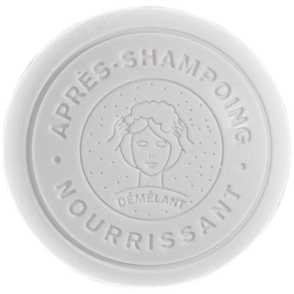Couvercle blanc rond en relief : "APRÈS-SHAMPOING NOURRISSANT DÉMÊLANT" et symbole de femme.