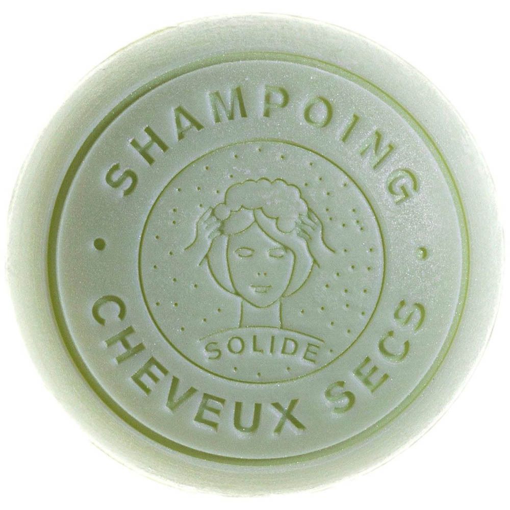 Pain de shampoing solide vert avec inscription en relief : 'Shampoing Solide Cheveux Secs' et visage stylisé.