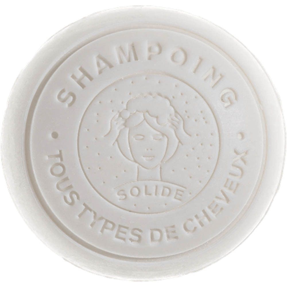Savon solide rond pour cheveux, avec une gravure de femme et du texte.
