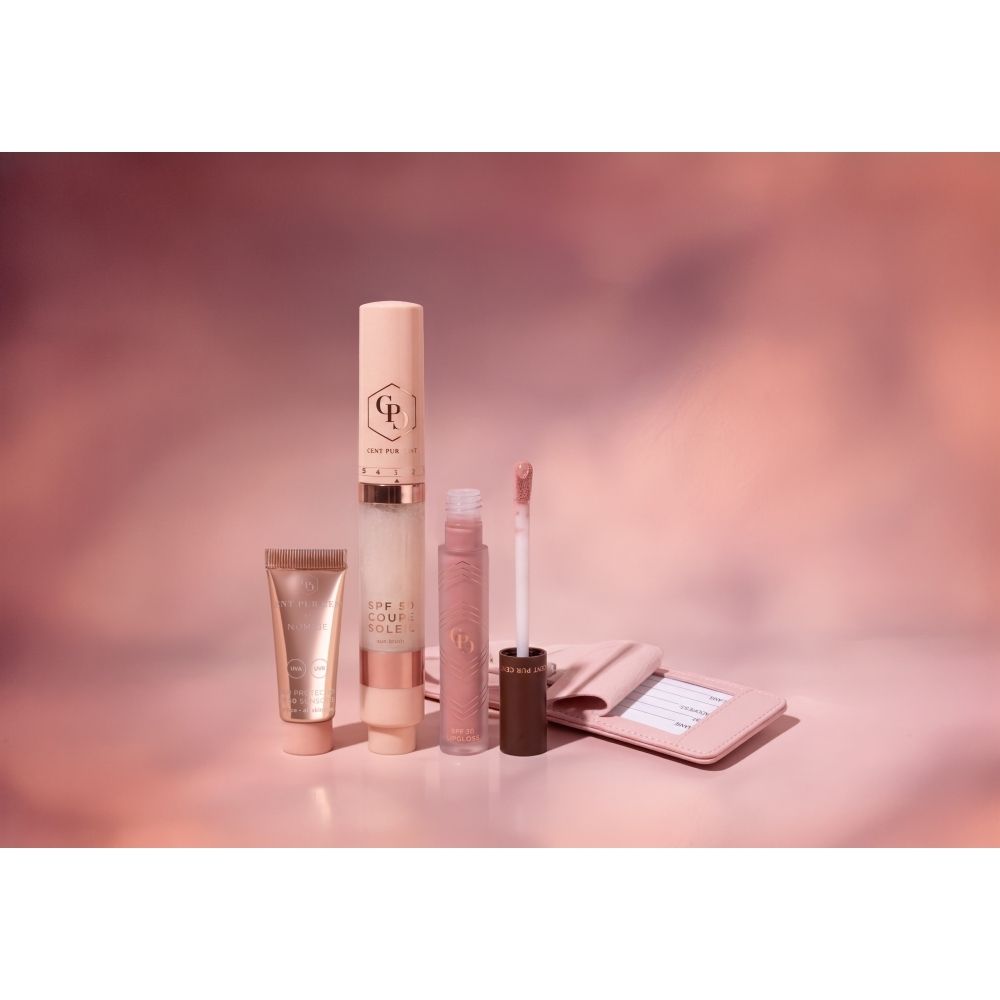 Boîte Cent Pur Cent SPF Essentials avec protection solaire, rouge à lèvres et miroir.