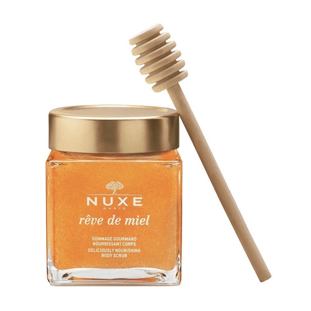 Gommage corps Nuxe Rêve de Miel dans un pot en verre avec spatule en bois.