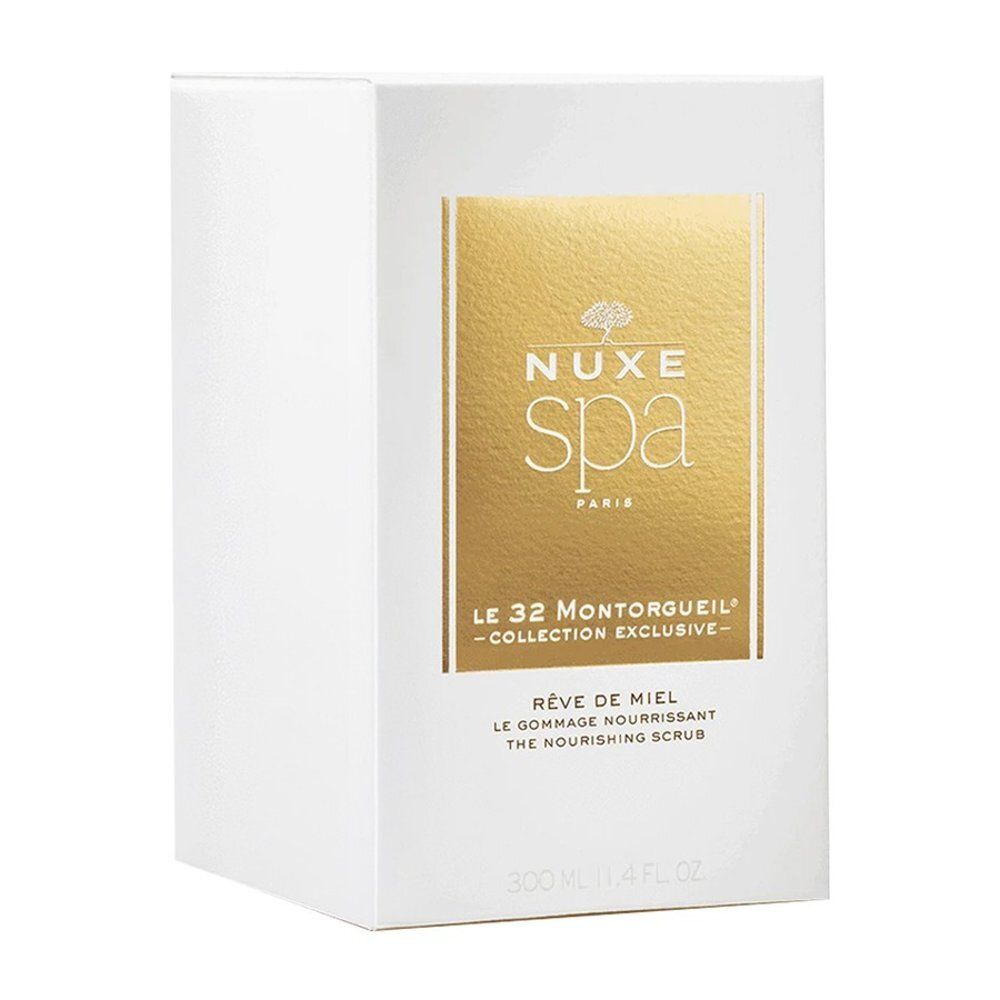 Boîte blanche avec façade dorée. Contient le Gommage Nourrissant Rêve de Miel Nuxe Spa, 300ml.