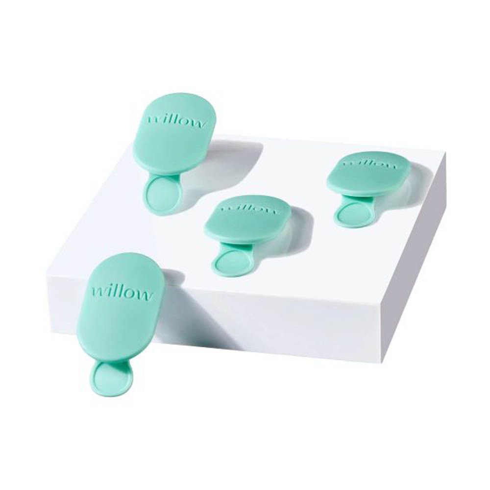 Quatre valves Elvie Wave vert menthe, chacune marquée du logo 'willow', disposées sur une surface blanche.