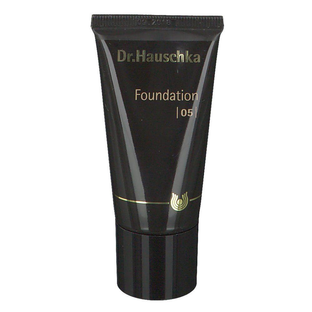 Tube noire avec inscription Dr. Hauschka Foundation 05. Texte et logo dorés. Bouchon noir.
