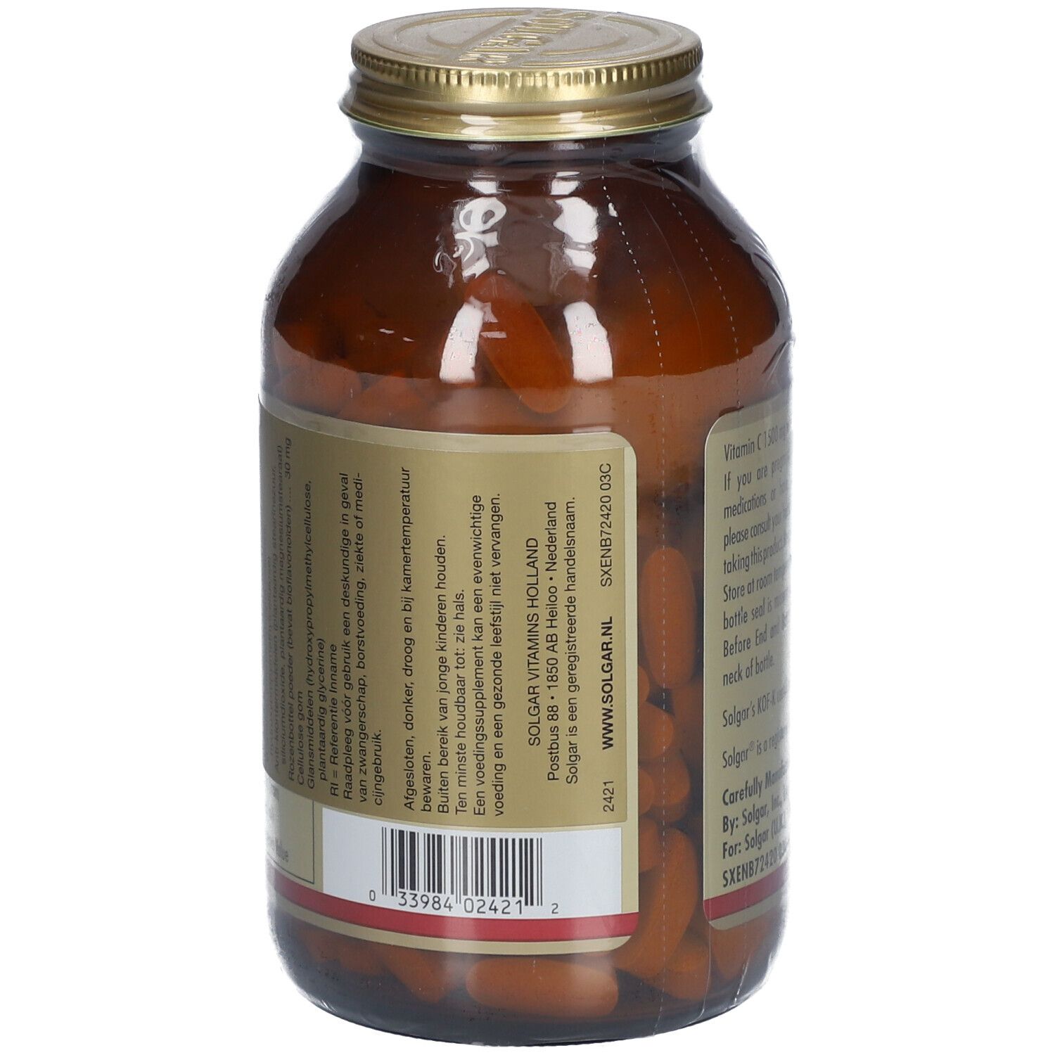 Vue arrière d'un flacon en verre brun. Étiquette: Vitamine C 1500 mg avec cynorrhodon. Informations et avertissements.