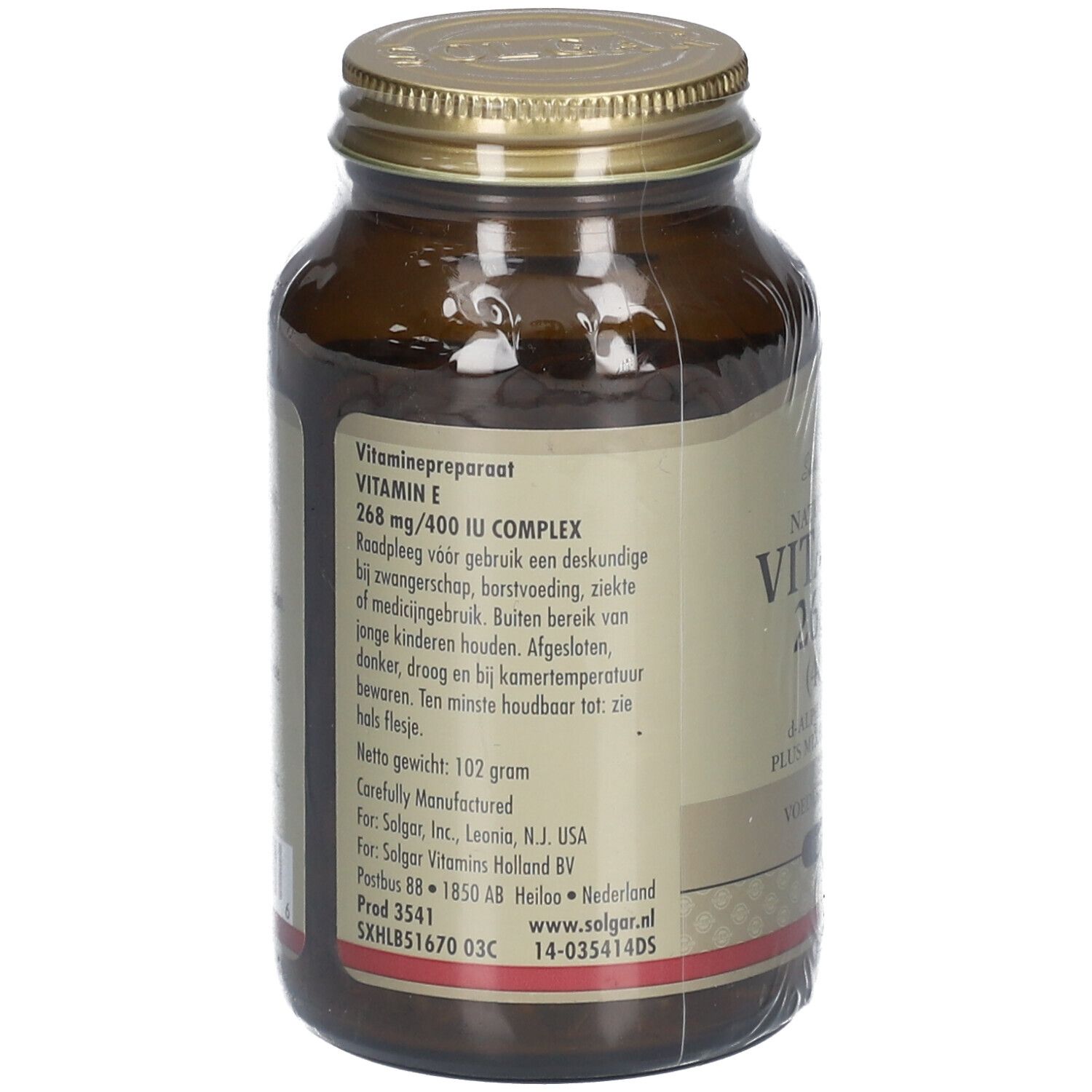 Flacon en verre brun avec bouchon à vis. Étiquette avec informations produit. Étiquette volante avec texte. Inscription: Vitamine E 268 mg/400 UI COMPLEX.