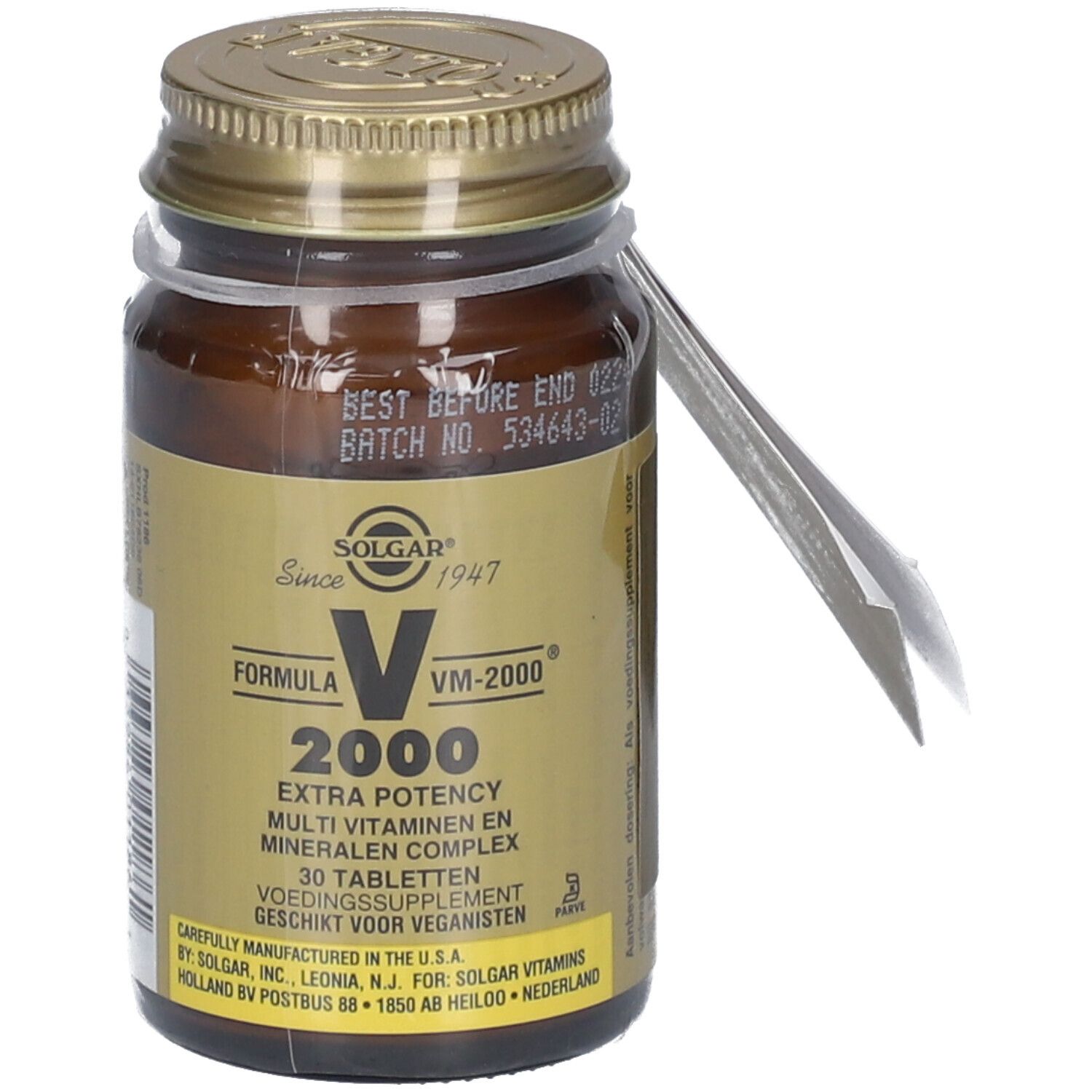 Flacon en verre brun avec couvercle doré. Étiquette avec nom du produit, texte et logo. Emballage plastique transparent. Étiquette avec texte.