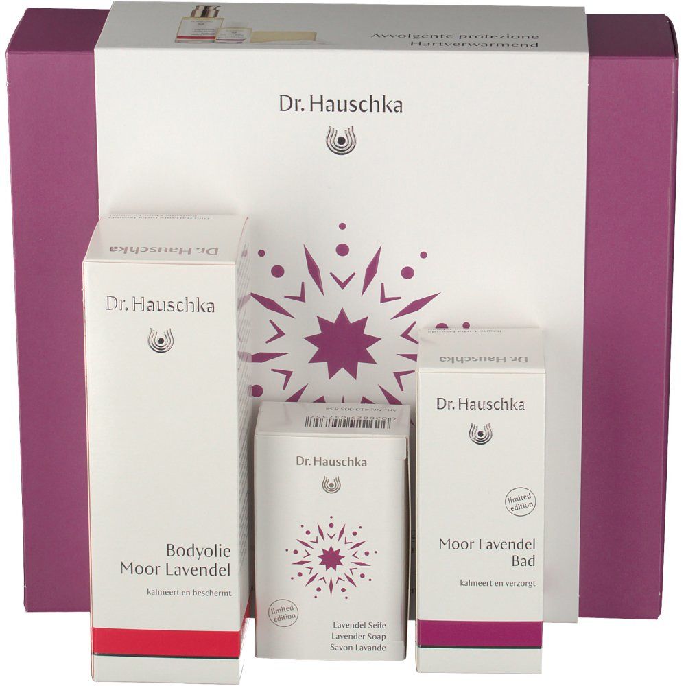 Coffret cadeau Dr. Hauschka. Contient lotion corporelle, savon et bain. Emballage avec accents violets et logo.
