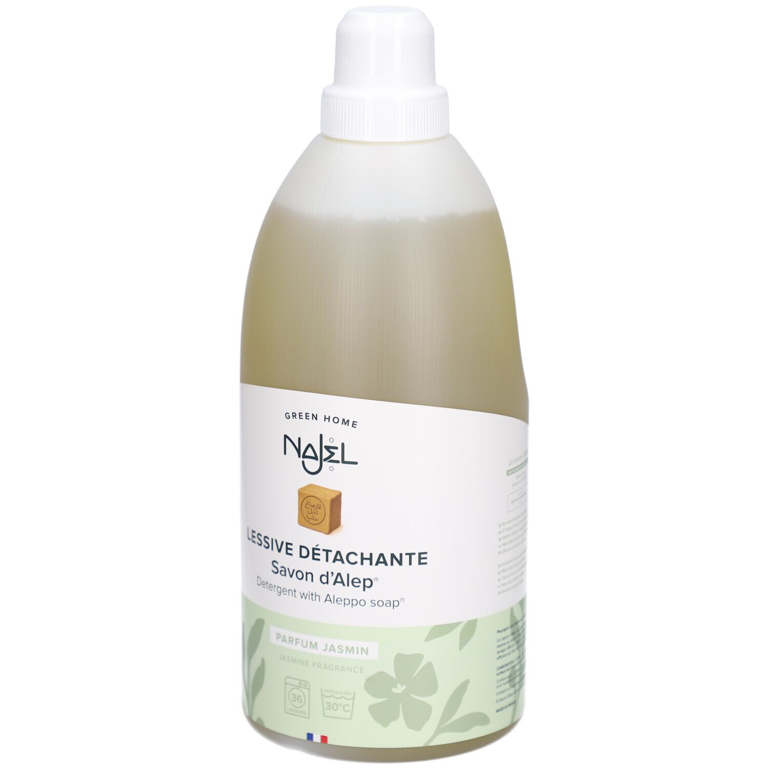 Lessive liquide en bouteille. Inscription: NAJEL, Lessive Détachante, Savon d'Alep. Parfum Jasmin. Étiquette verte.