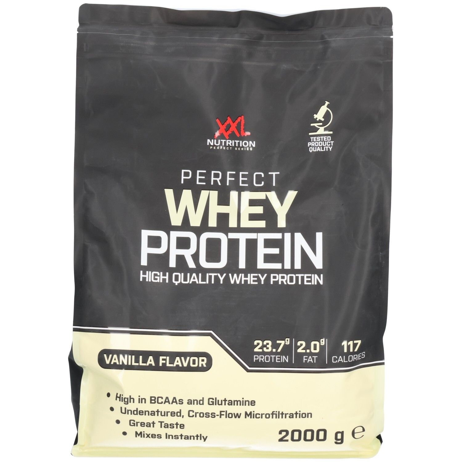 Sachet noir avec impression de produit. Inscription : Perfect Whey Protein, saveur vanille. Contient des informations nutritionnelles et un logo.