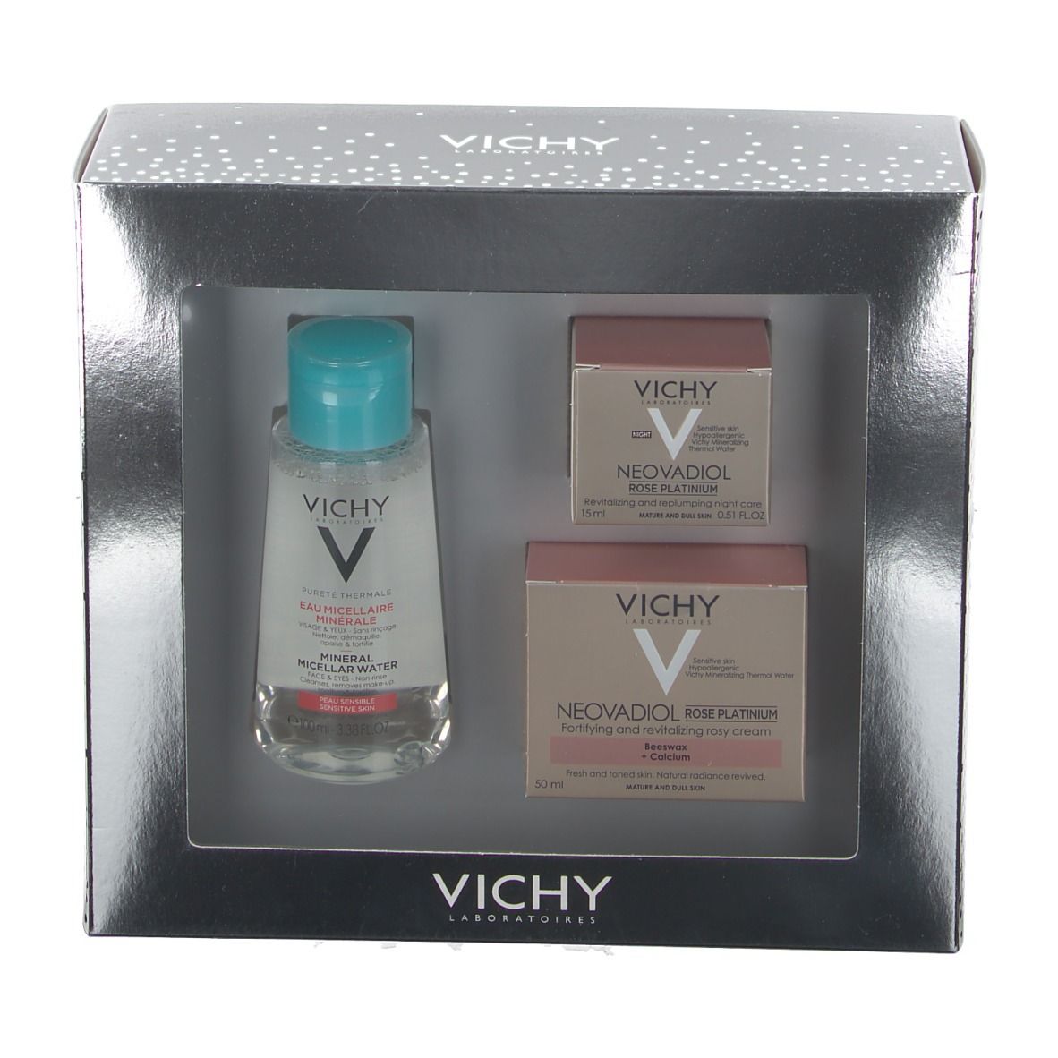 Coffret cadeau Vichy argenté avec trois produits : eau micellaire, crème rosé et soin de nuit. Marque et noms visibles.