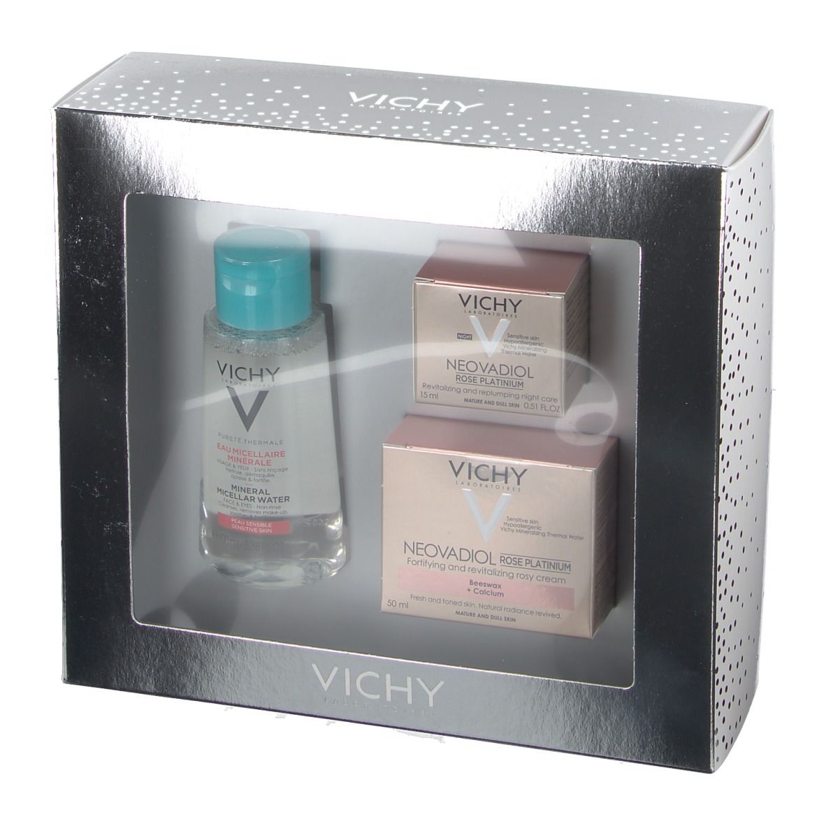 Coffret cadeau Vichy argenté avec trois produits : eau micellaire, crème rosé et soin de nuit. Marque et noms visibles.