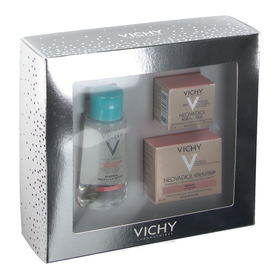 Coffret cadeau Vichy argenté avec trois produits : eau micellaire, crème rosé et soin de nuit. Marque et noms visibles.