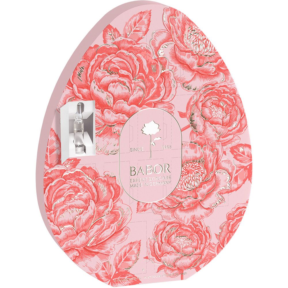 Emballage en forme d'œuf avec motif floral et logo Babor. Fond rose, détails dorés. Ampoule visible.