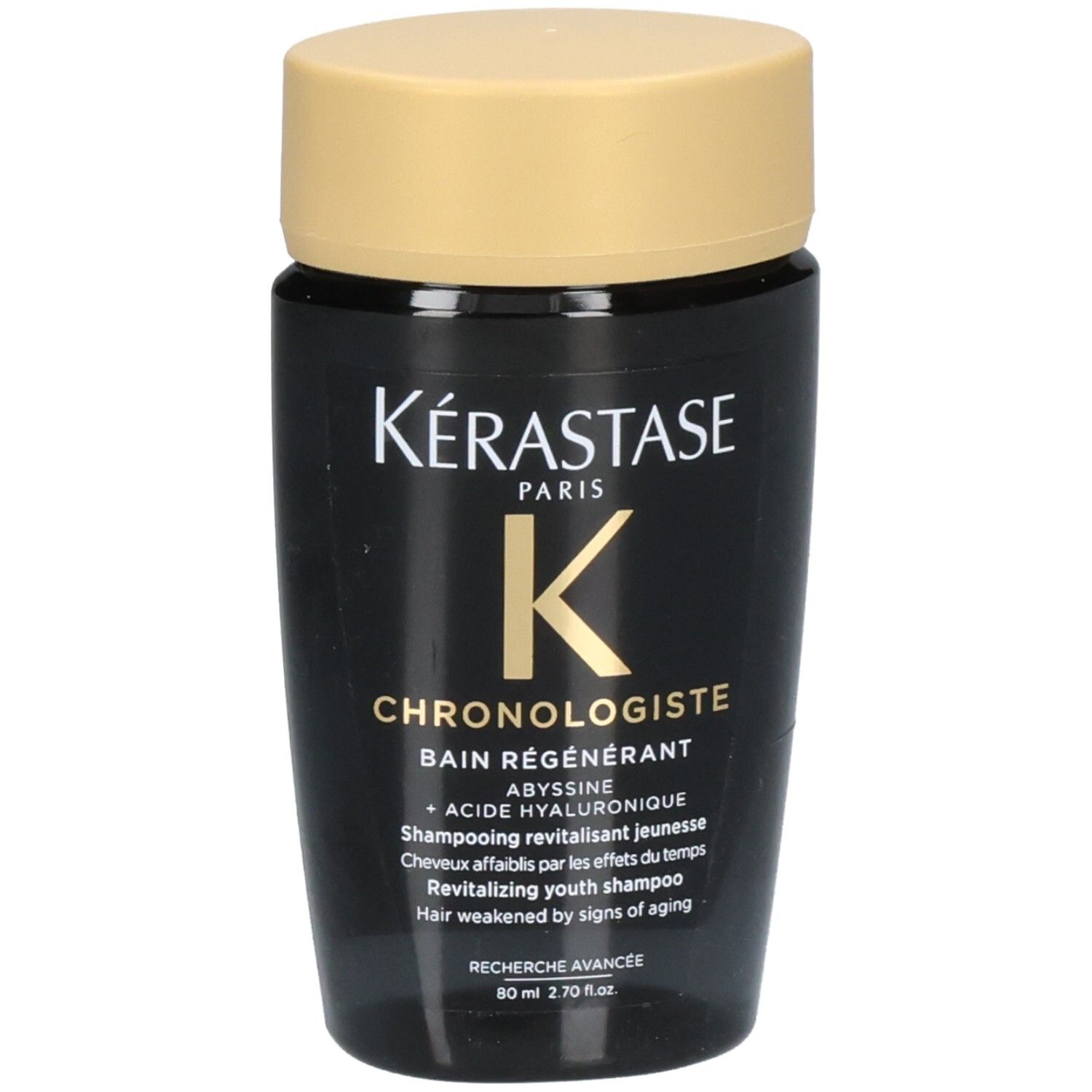 Flacon noir avec bouchon doré, Kérastase Chronologiste Bain Régénérant Shampoo, 80 ml.