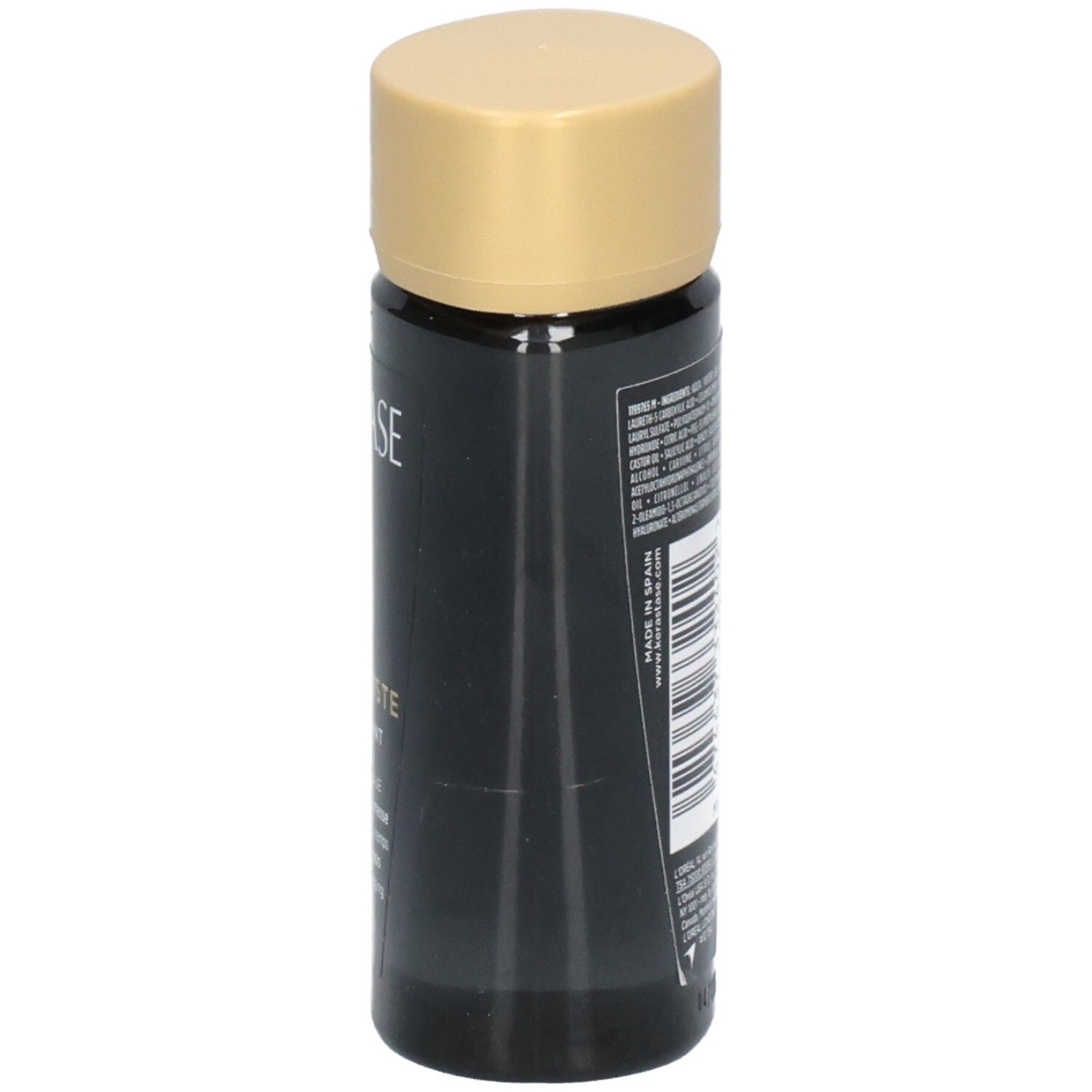 Bouteille noire avec bouchon doré, étiquette avec texte.