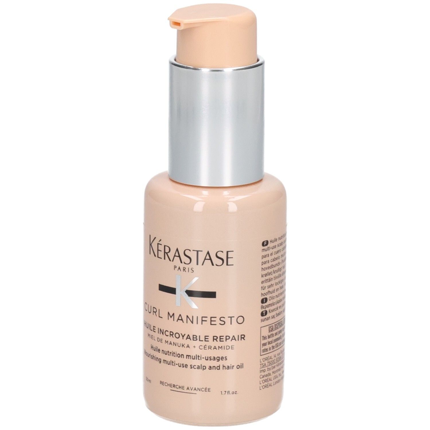 Flacon Kérastase Curl Manifesto Huile Incroyable Repair avec pompe. Flacon beige avec col argenté et pompe de couleur claire.