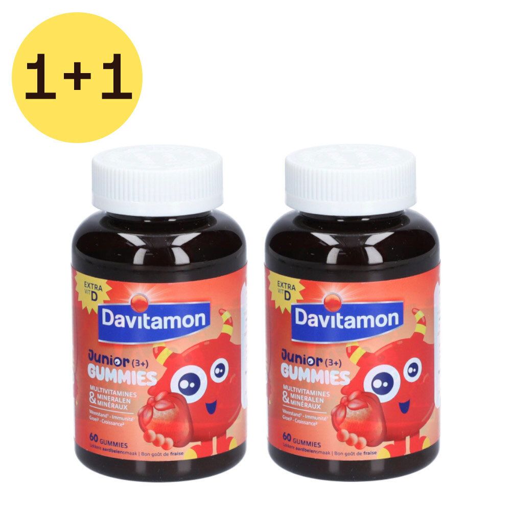 Deux flacons de Davitamon Junior Gummies avec autocollant 1+1 gratuit. Étiquettes rouges, couvercles blancs. Inscription : Junior Gummies.