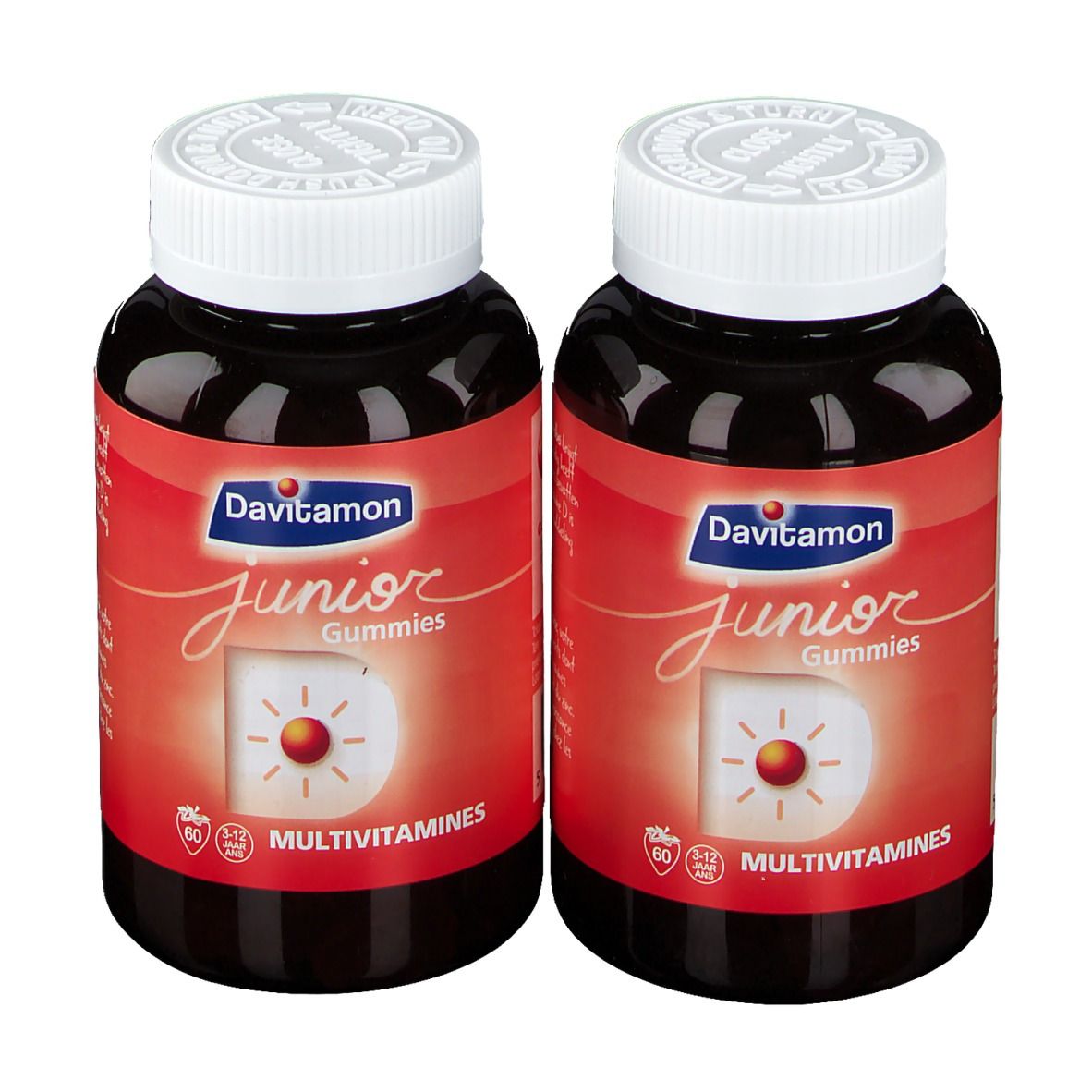 Deux flacons de Davitamon Junior Gummies. Étiquettes rouges, couvercles blancs. Inscription : Junior Gummies, Multivitamines.