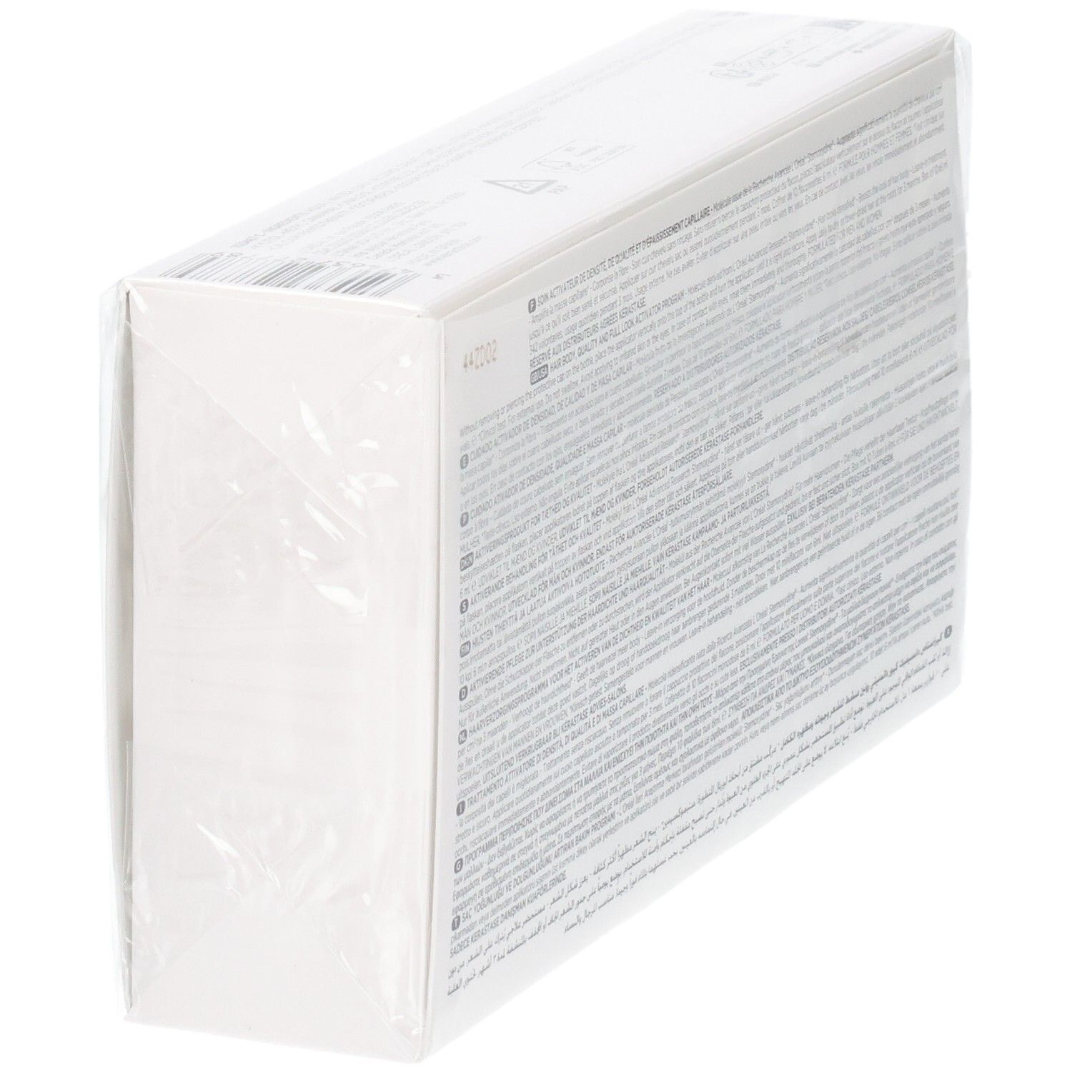 Emballage produit blanc, imprimé de texte sur le côté et scellé sous film plastique transparent.