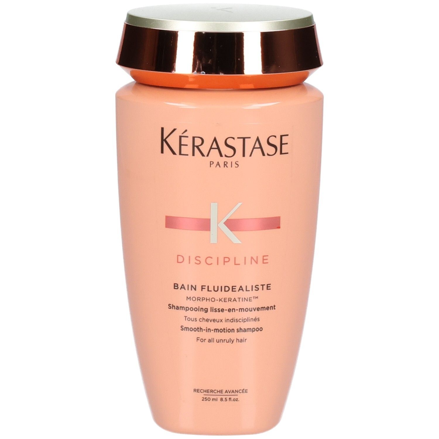 Shampoing Kérastase Discipline Bain Fluidéaliste, 250ml. Flacon pêche avec bouchon argenté et cuivré.