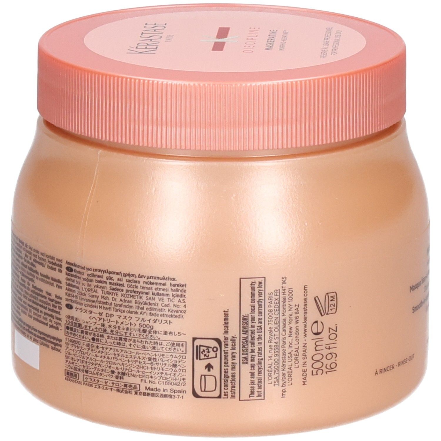 Un pot de masque capillaire Kérastase de 500ml avec un couvercle rose et un corps pêche.