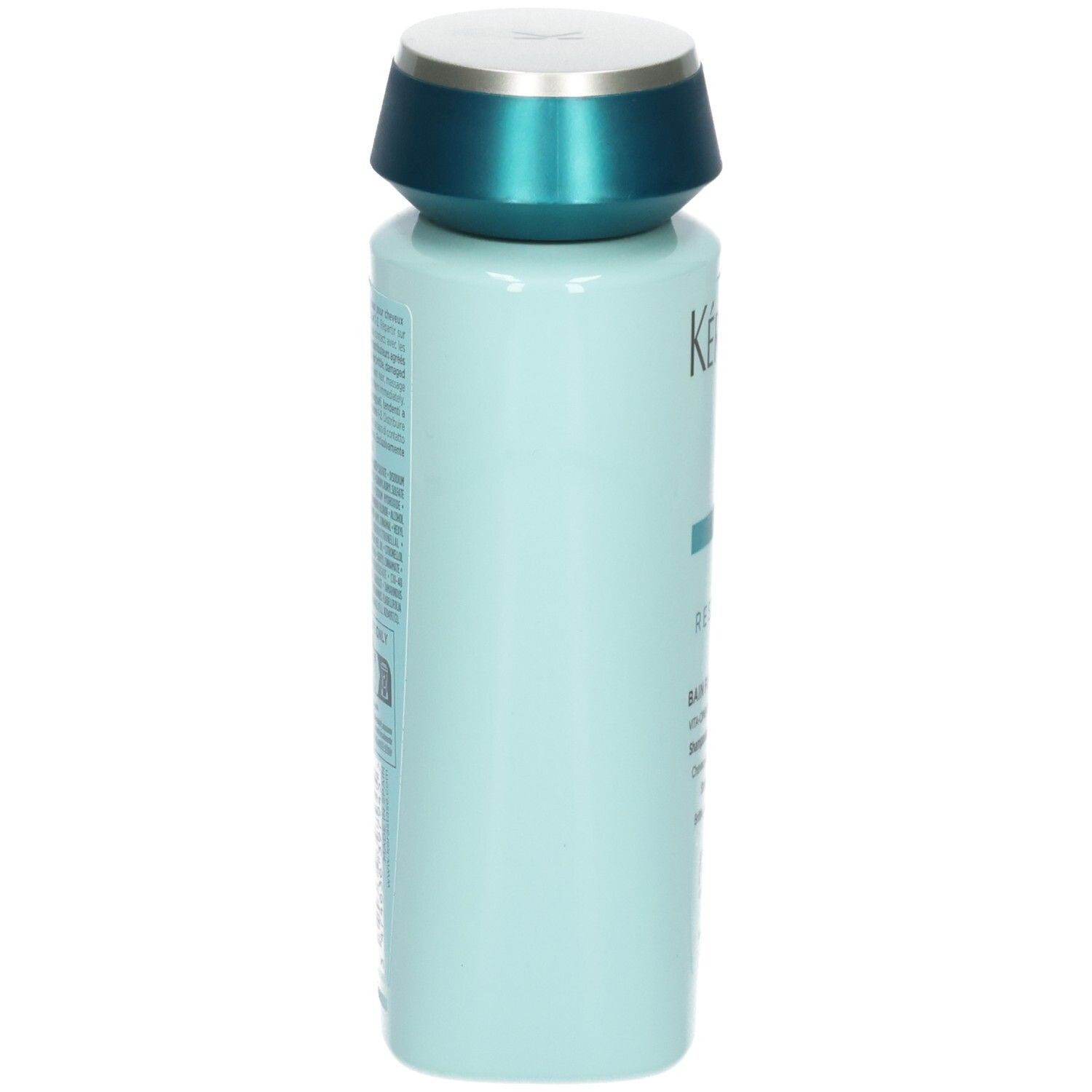 Vue latérale de la bouteille de shampooing Kérastase bleu clair avec bouchon turquoise.