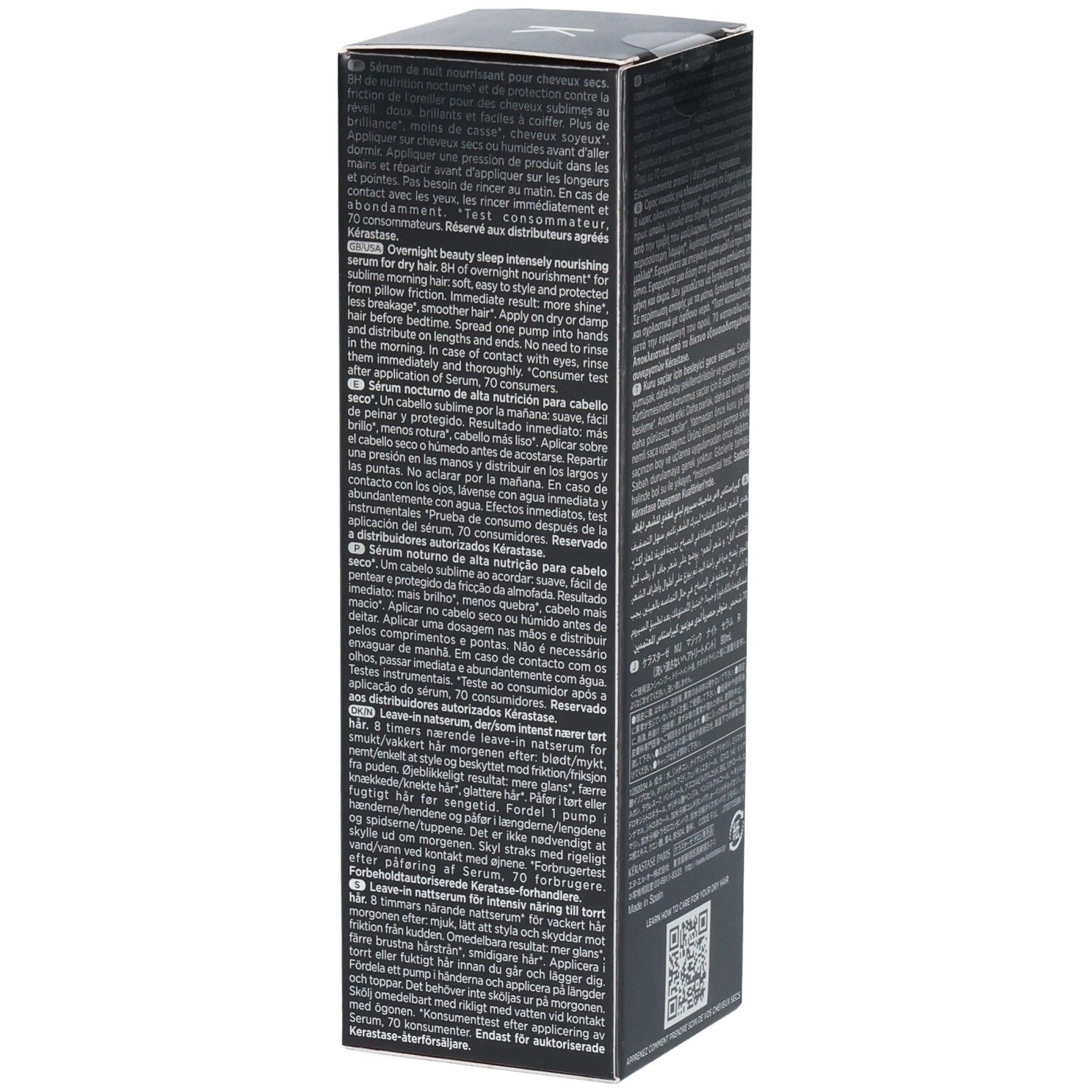 Boîte grise foncée pour sérum Kerastase avec texte multilingue.