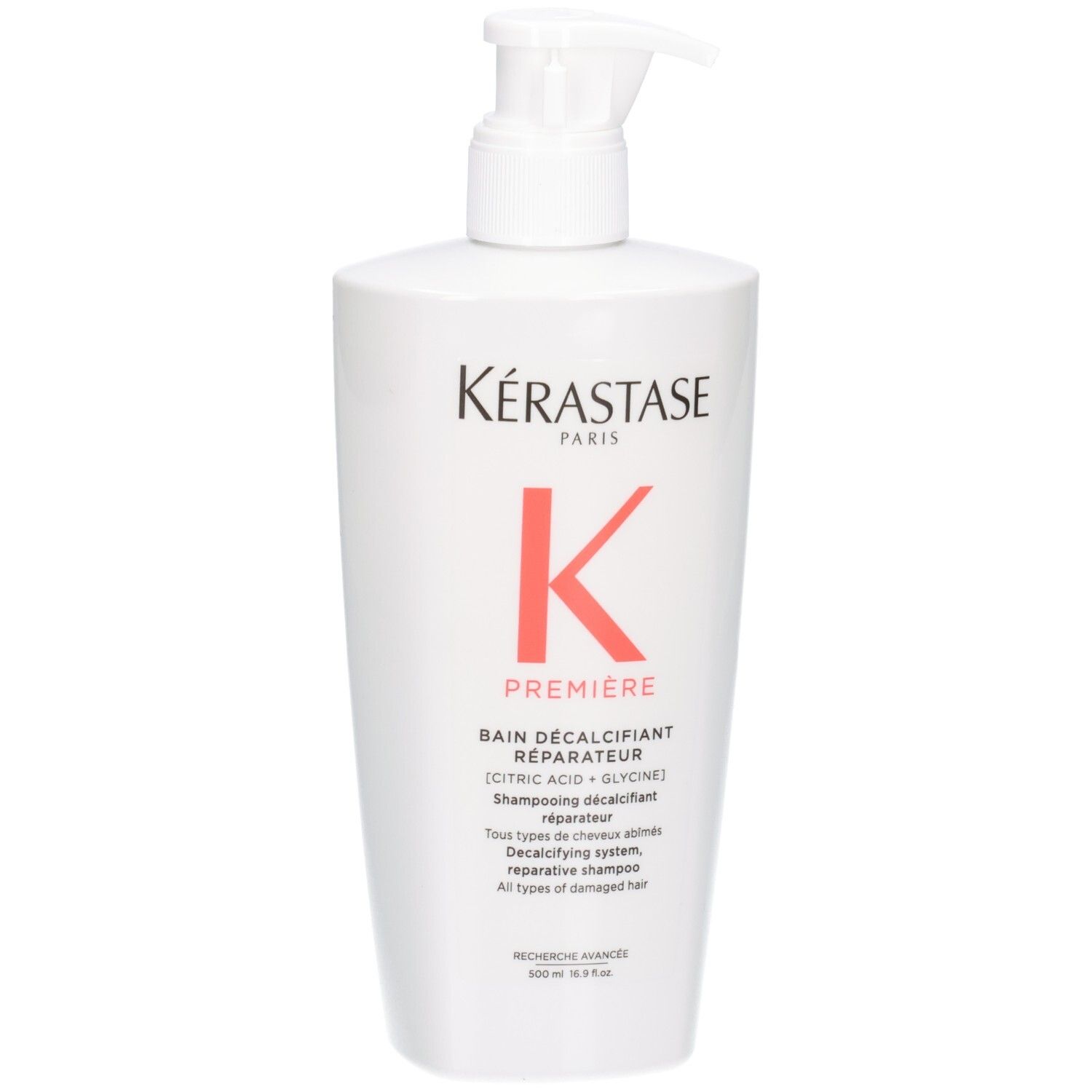 Flacon blanc Kérastase Bain Décalcifiant Réparateur shampooing avec pompe.