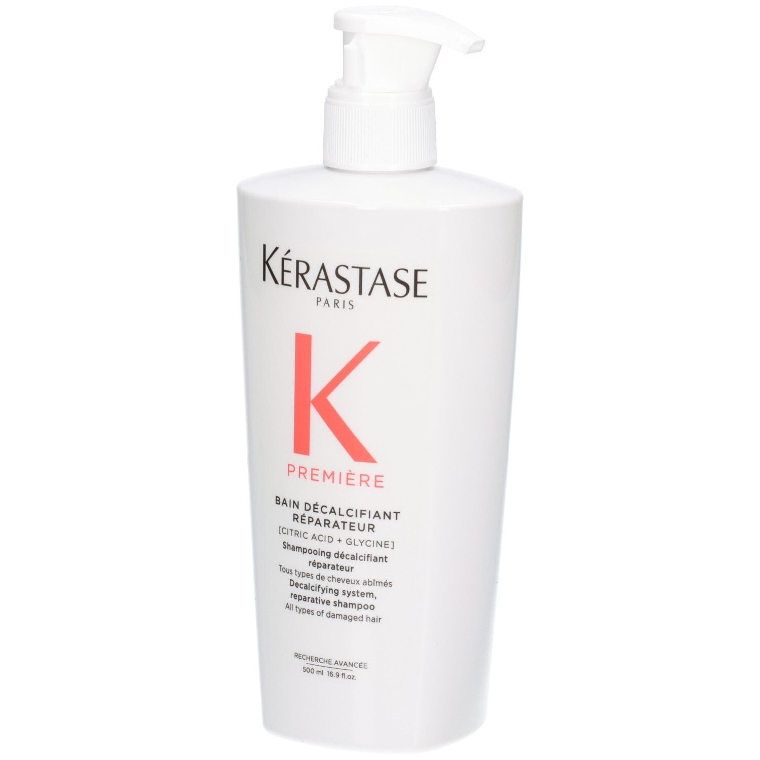 Flacon blanc Kérastase Bain Décalcifiant Réparateur shampooing avec pompe.