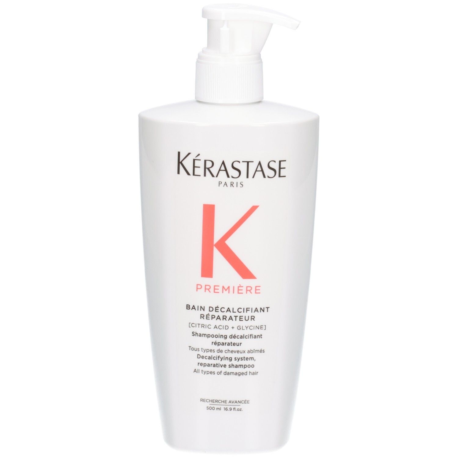 Flacon blanc Kérastase Bain Décalcifiant Réparateur shampooing avec pompe.