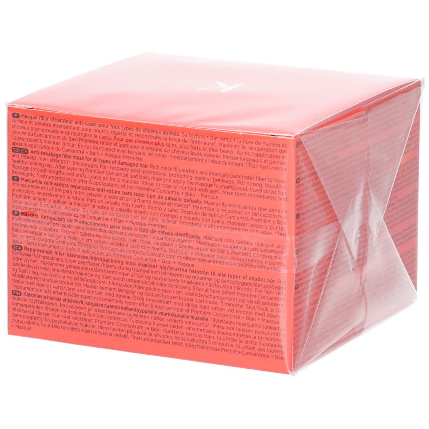 Emballage rouge pour un masque capillaire avec texte multilingue.