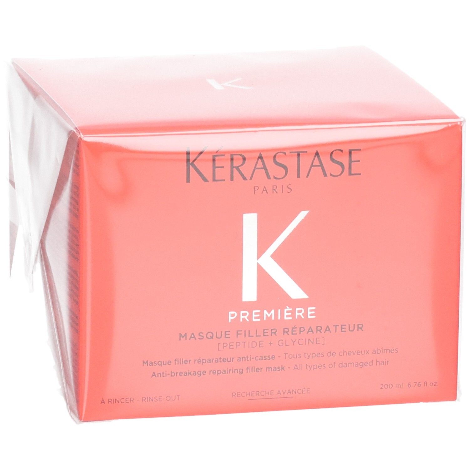 Kérastase Première Masque Filler Réparateur soin capillaire dans un emballage corail avec logo K blanc.