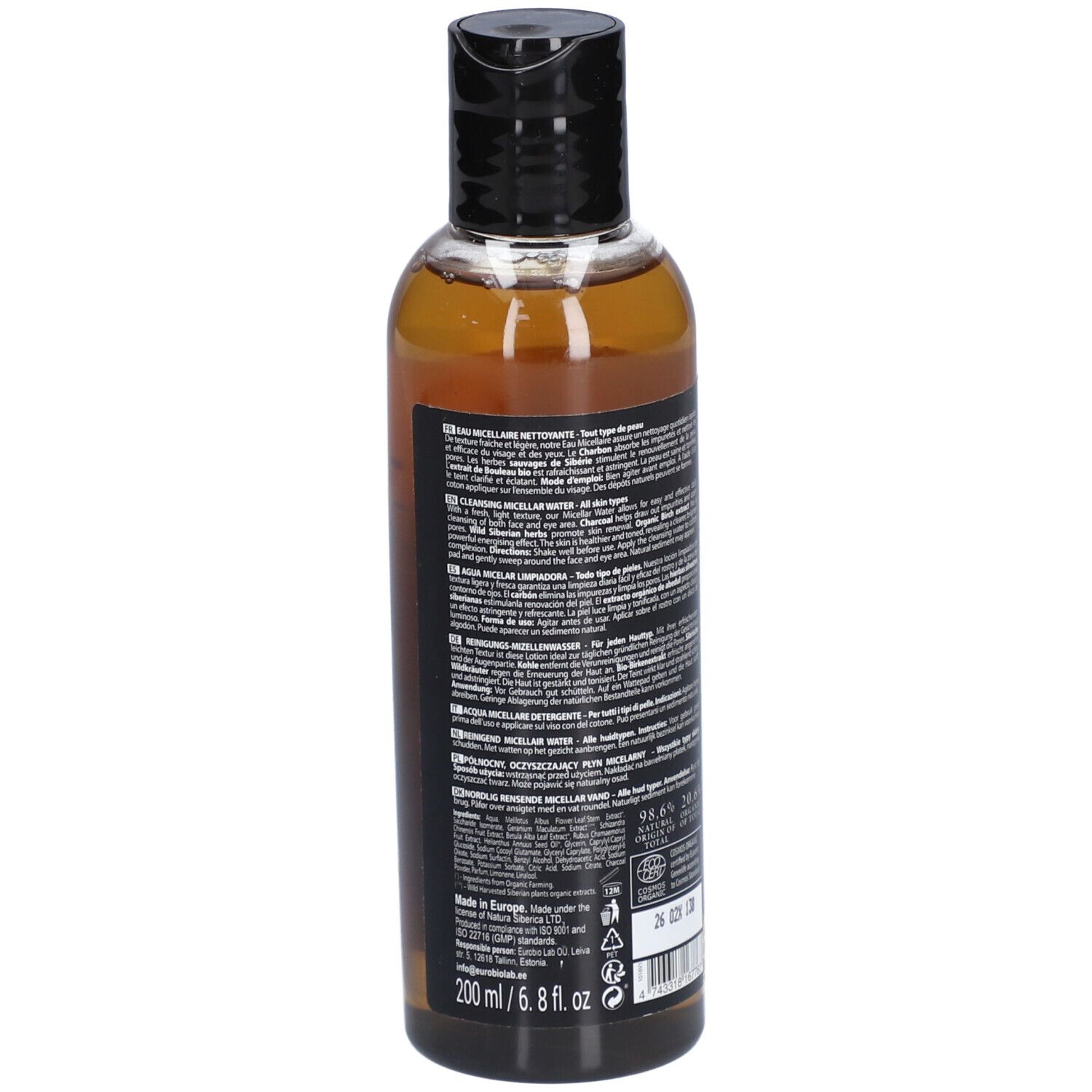 Vue arrière du flacon. Étiquette noire avec texte. Informations sur les ingrédients et le fabricant. Flacon transparent avec liquide brun. Bouchon noir.