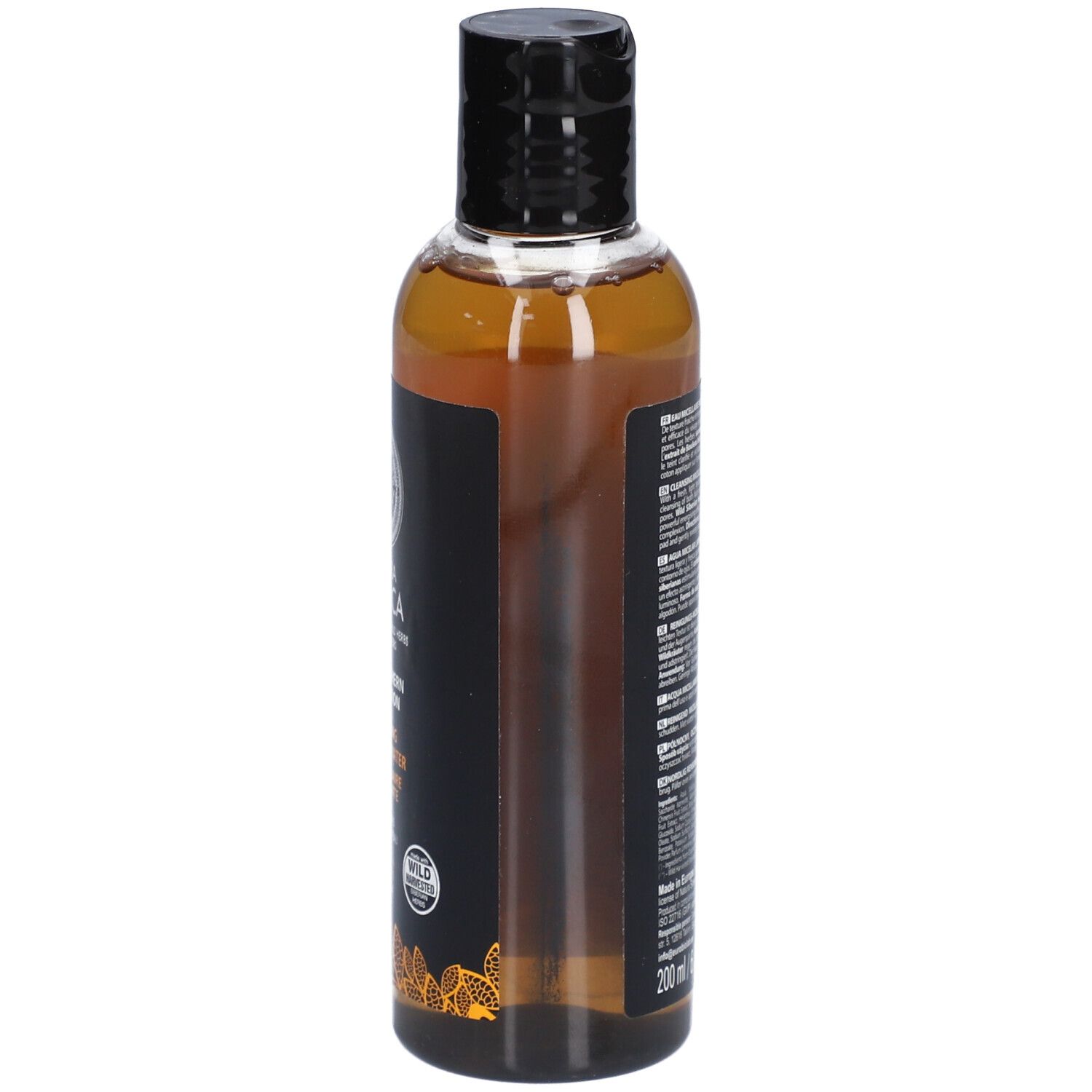 Flacon transparent avec bouchon noir. Étiquette noire avec texte. Contient des informations sur le produit. Flacon transparent avec liquide brun.