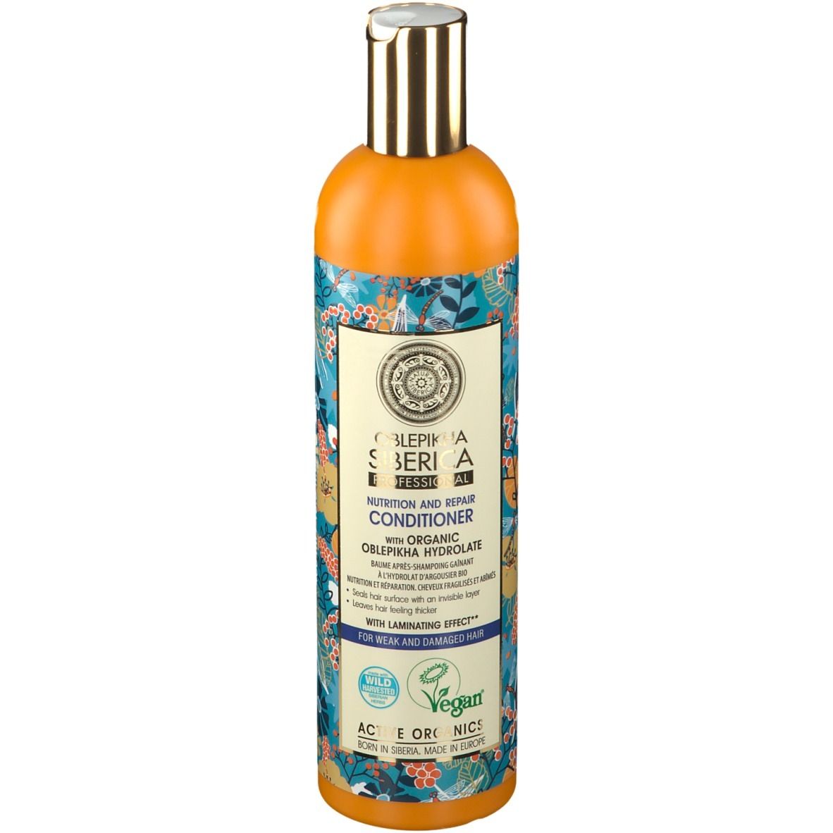 Flacon orange avec motif floral. Étiquette avec informations produit et logo. Label vegan.