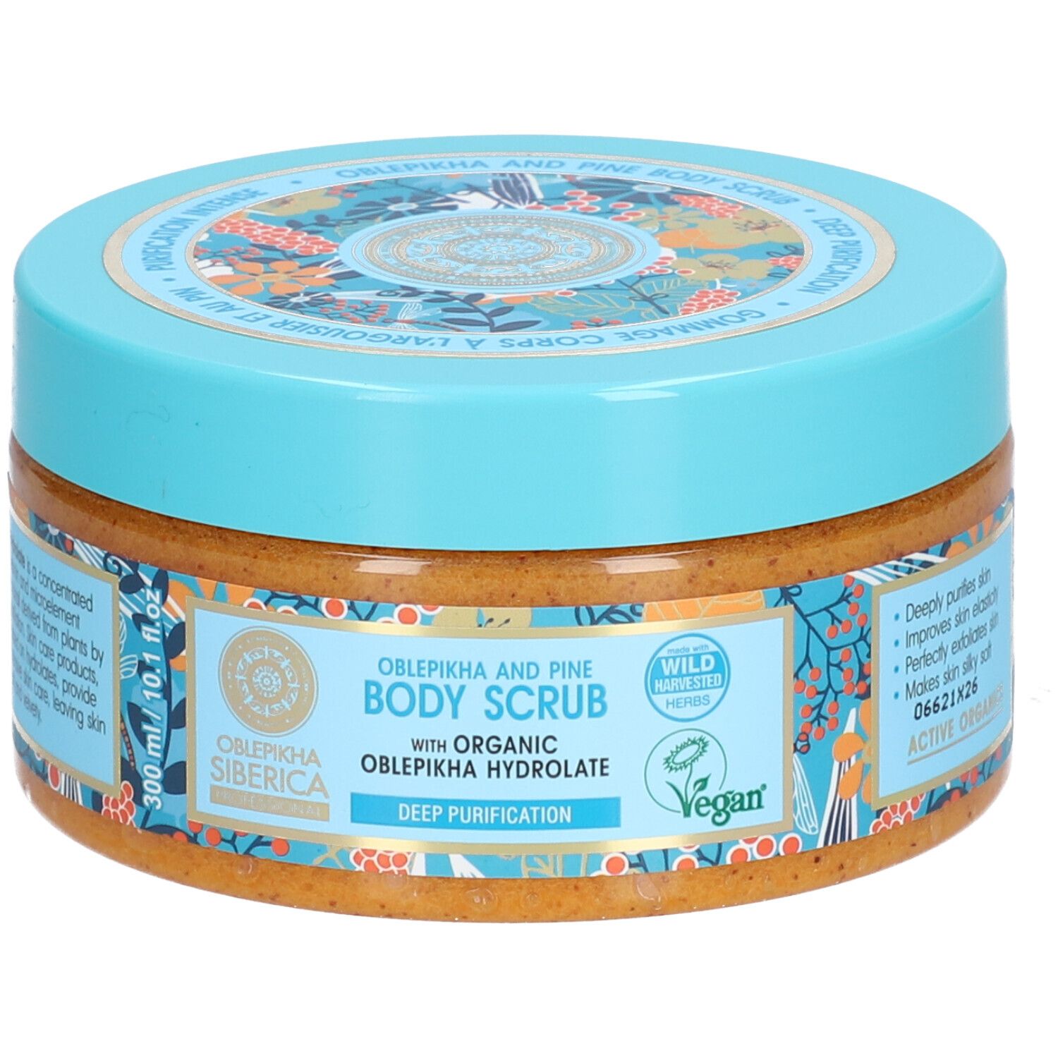 Pot rond avec couvercle bleu. Inscription: Oblepikha and Pine Body Scrub. Label Vegan. 300 ml.