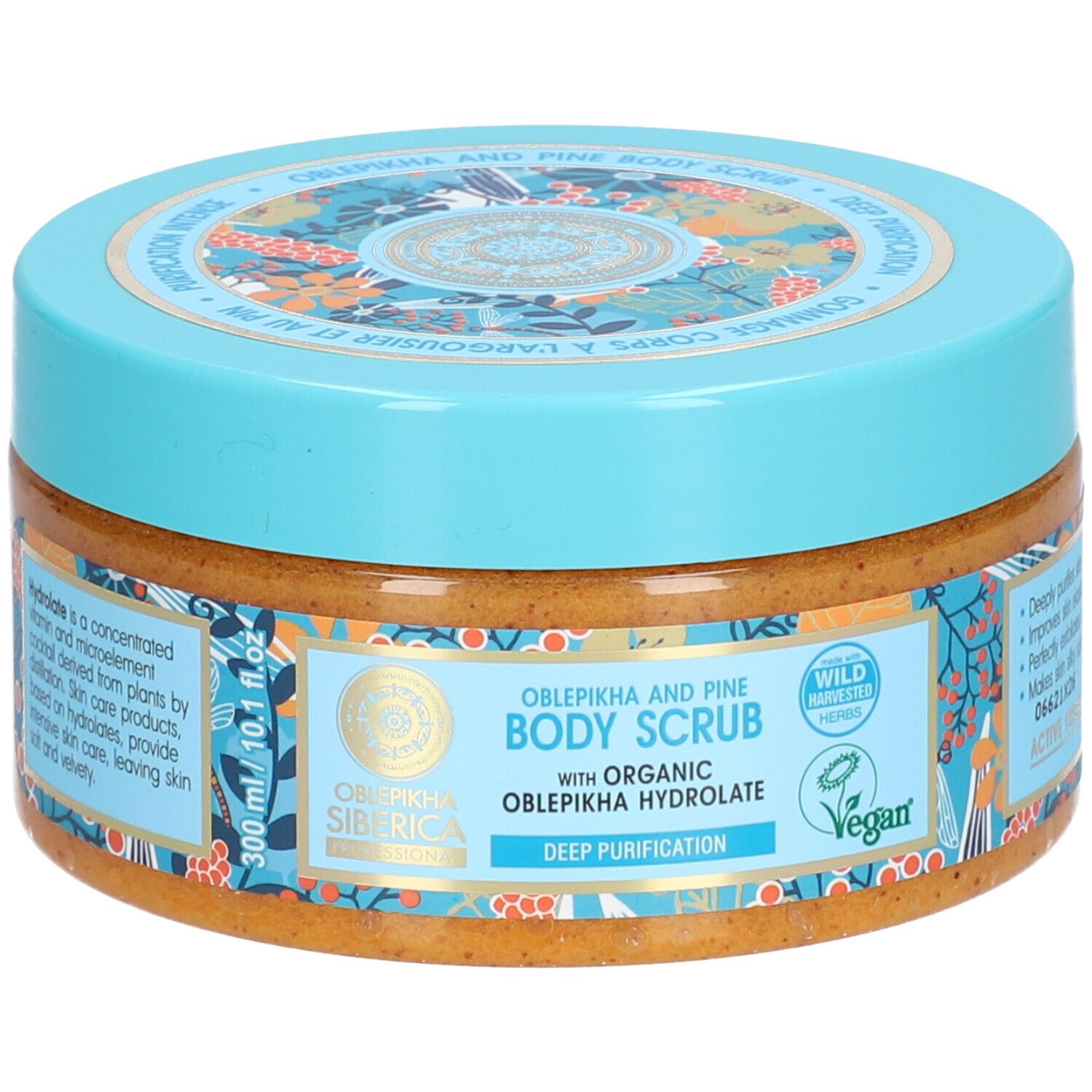 Pot rond avec couvercle bleu. Inscription: Oblepikha and Pine Body Scrub. Label Vegan. 300 ml.