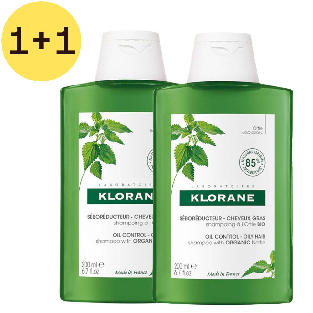 Deux flacons de shampooing verts avec bouchons blancs. Inscription Klorane, Séboréducteur, offre 1+1 gratuite. Logo ortie bio.
