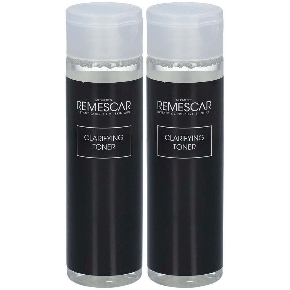 Deux flacons de toner. Flacons noirs avec bouchons blancs. Inscription : Remescar, Clarifying Toner.