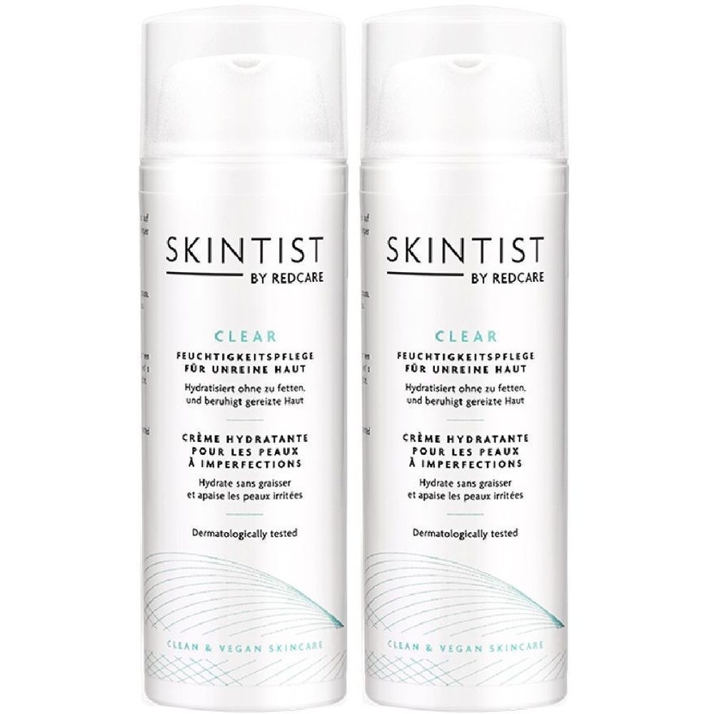 Deux flacons blancs de SKINTIST CLEAR. Crème hydratante pour peaux à imperfections. Bouchon blanc et texte.