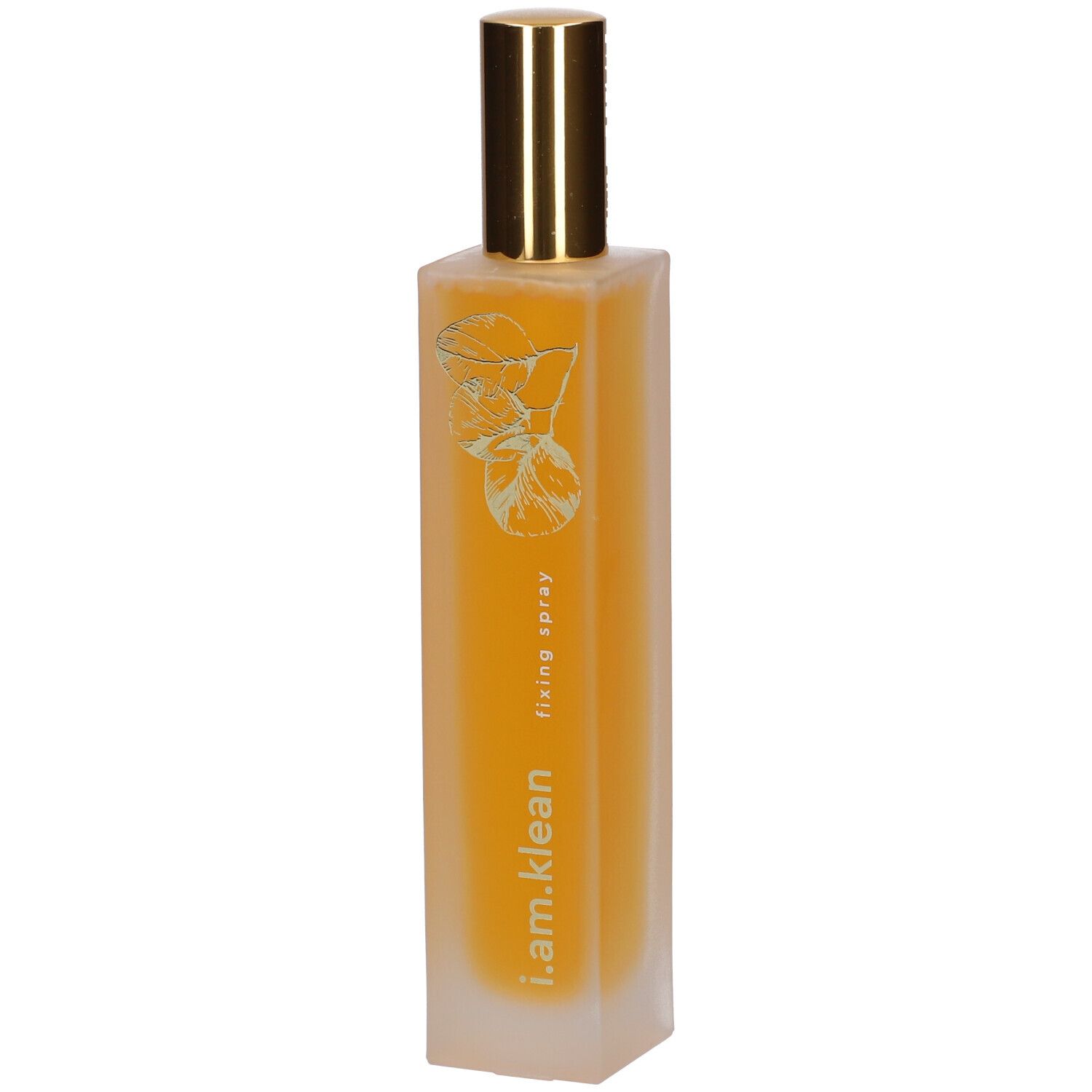 Flacon cylindrique avec vaporisateur doré. Inscription : i.am.klean, fixing spray. Liquide jaune visible.